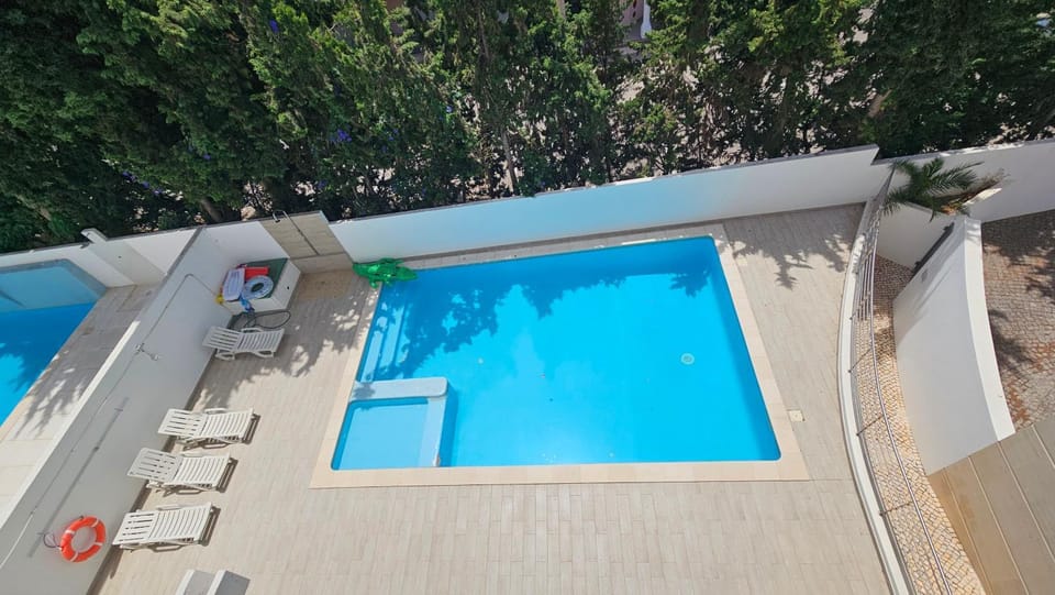 Property building, Pool view, Swimming pool, sunbed