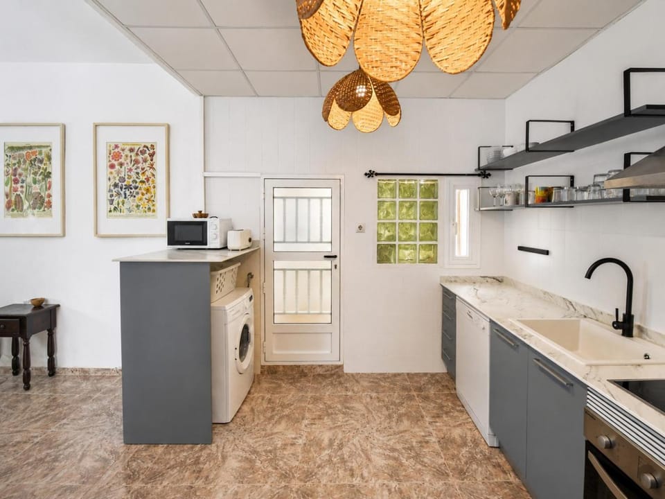 Kitchen or kitchenette, dishwasher, oven, stove, toaster