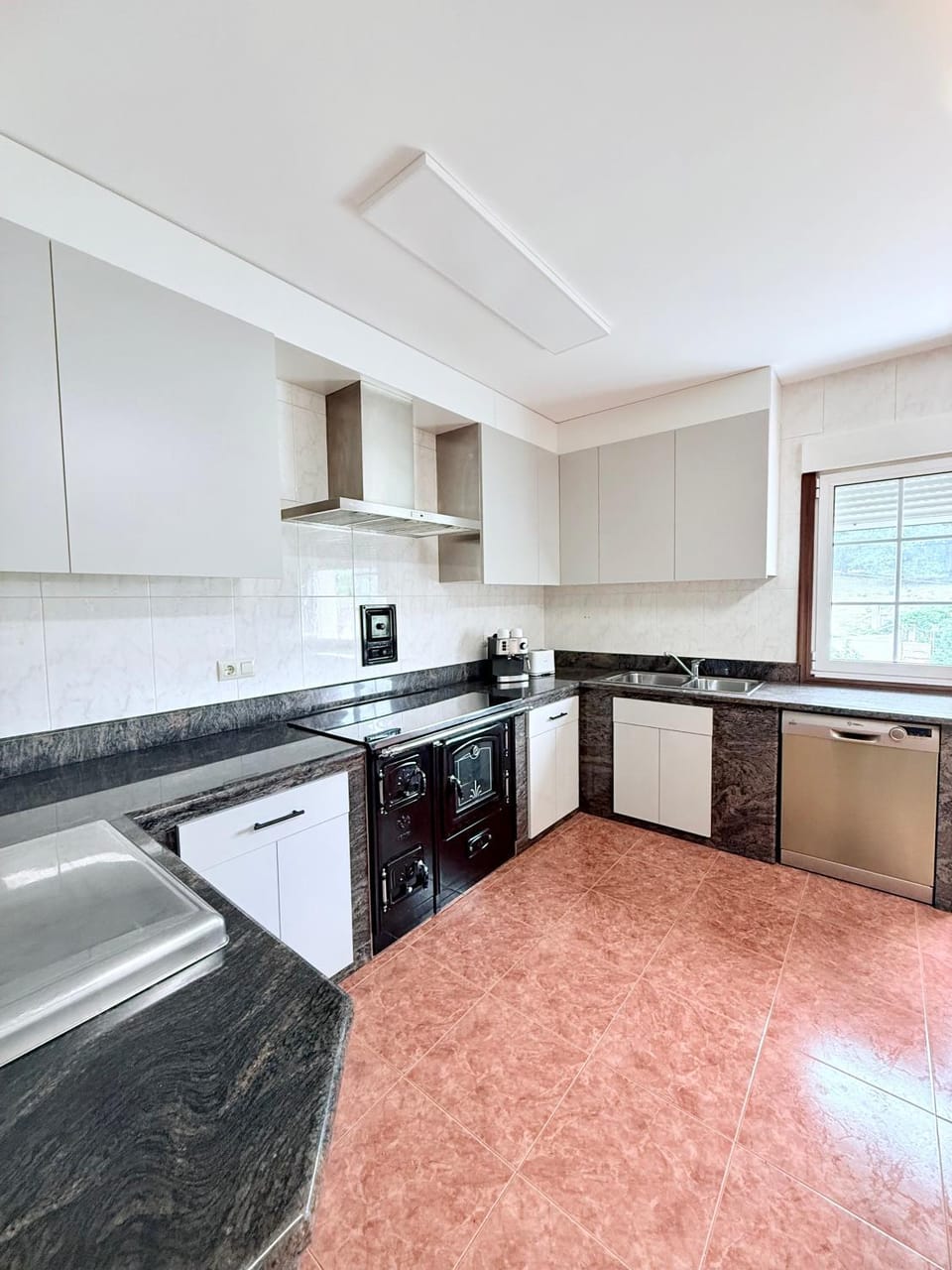 Kitchen or kitchenette, dishwasher, oven, stove, toaster