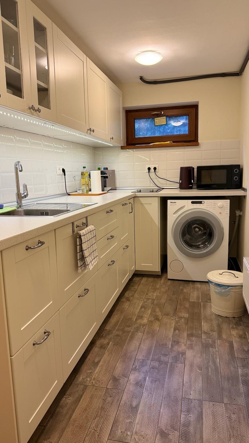 Kitchen or kitchenette, washing machine