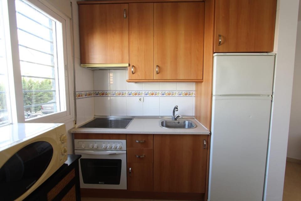 Kitchen or kitchenette, oven, stove