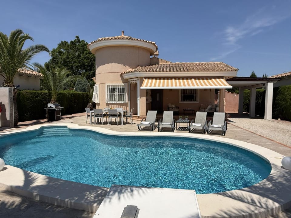 Property building, Living room, Swimming pool