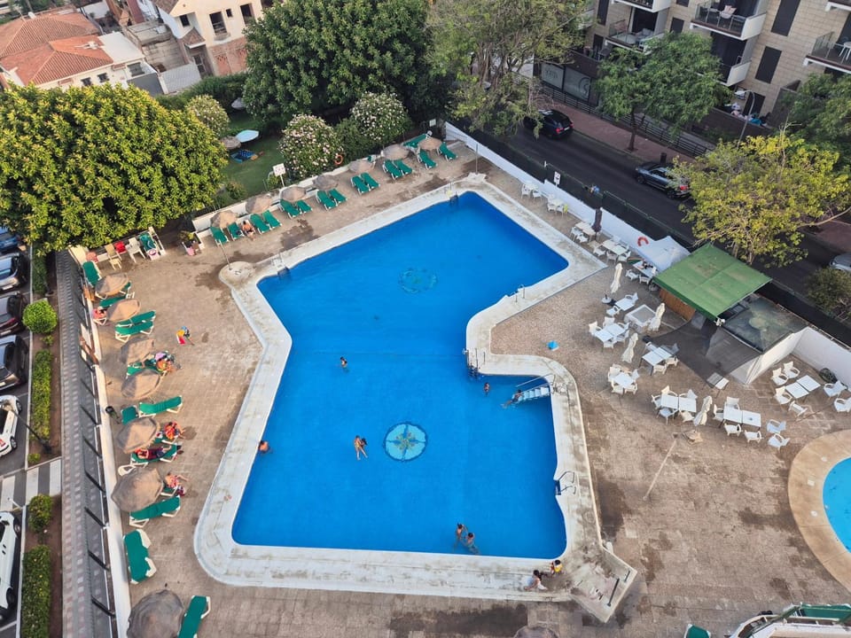 Property building, Living room, Swimming pool