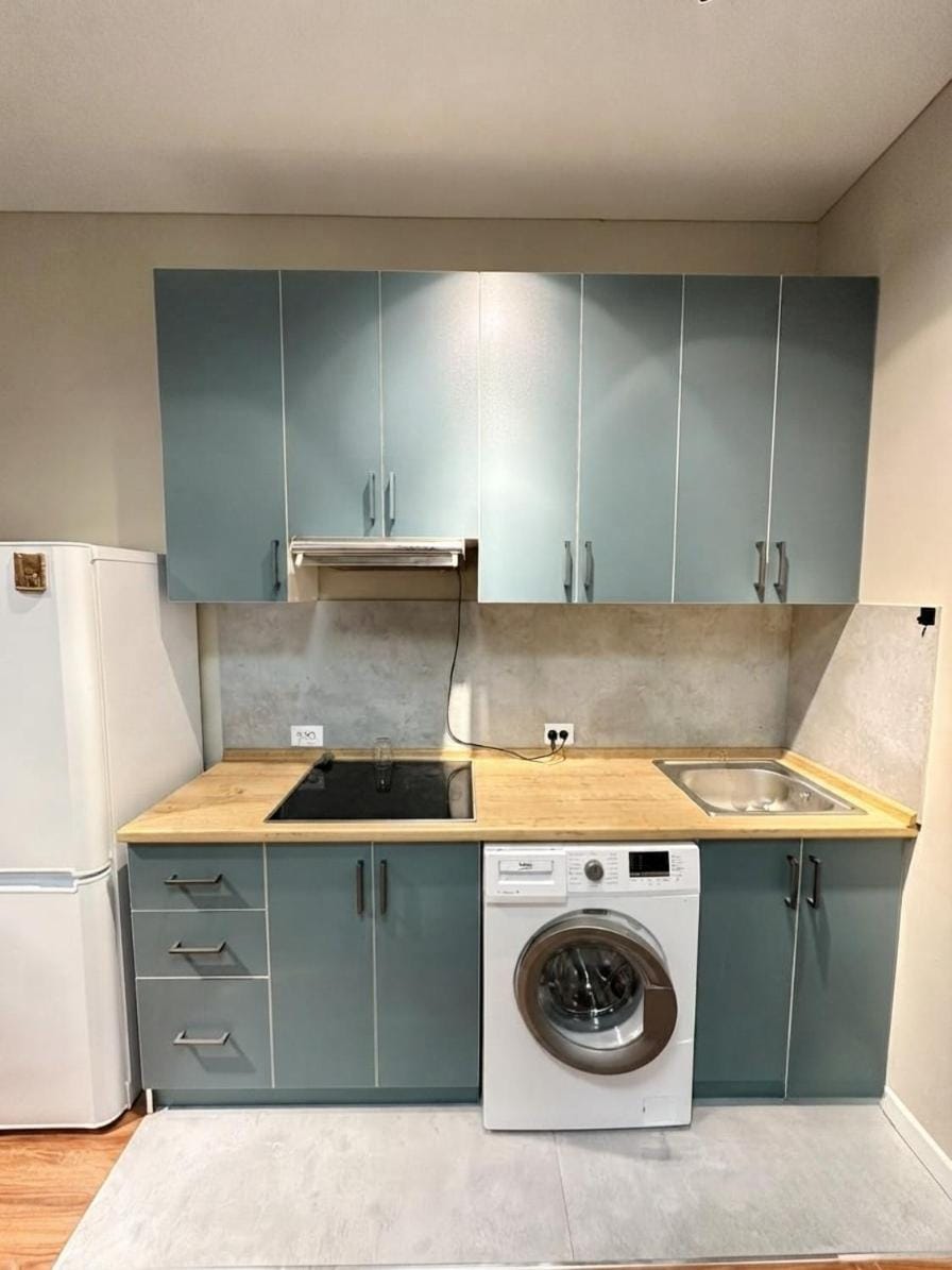 Kitchen or kitchenette, washing machine