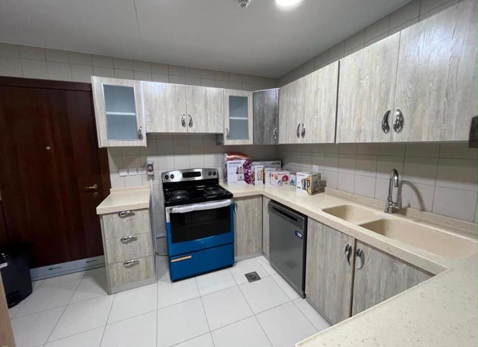 Kitchen or kitchenette, dishwasher, oven, stove