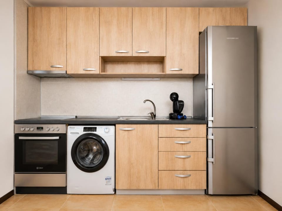 Kitchen or kitchenette, oven, stove, washing machine