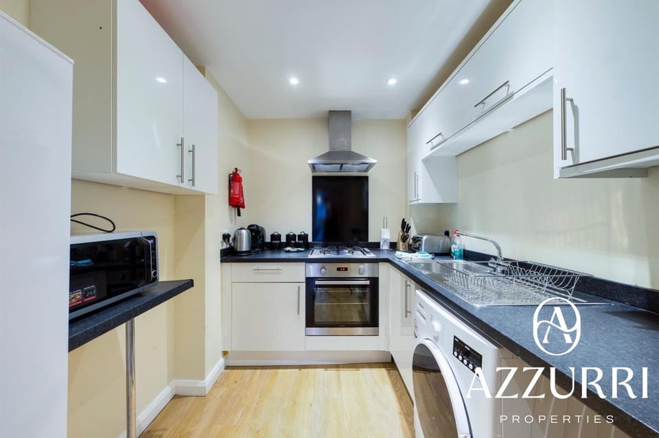 Kitchen or kitchenette, dishwasher, oven, stove, toaster