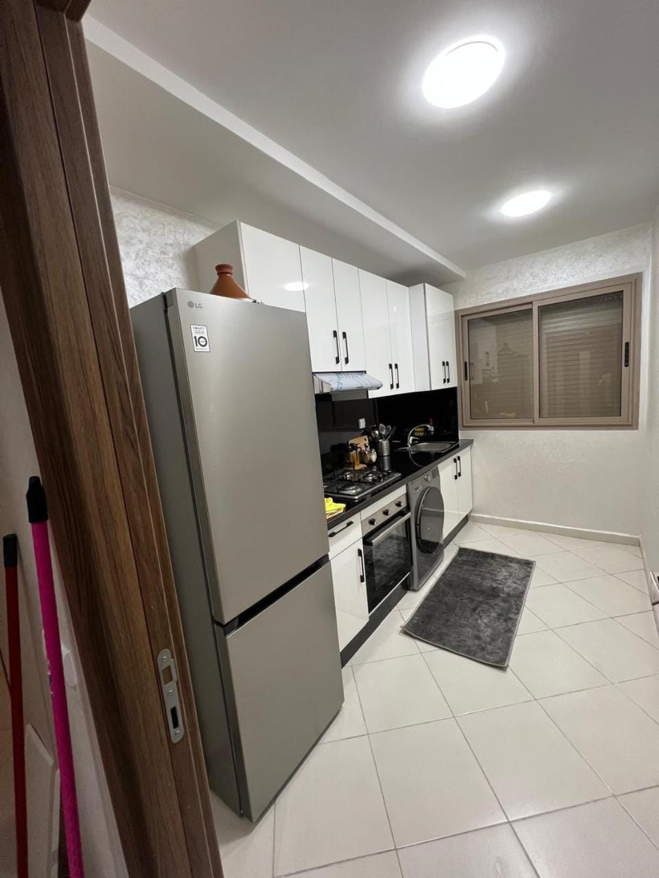 Kitchen or kitchenette, oven, stove, washing machine