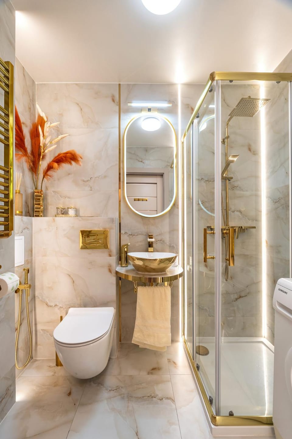 Shower, Toilet, Bathroom, bidet, hair dryier, towels, washing machine