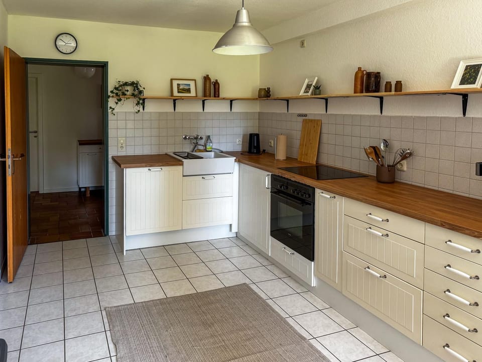 Kitchen or kitchenette, dishwasher, oven, stove
