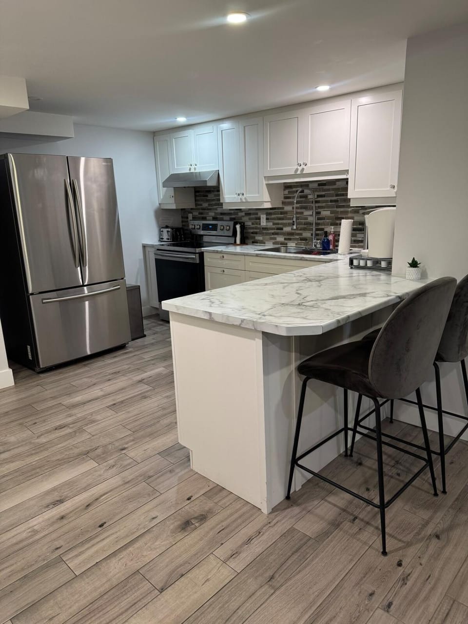 Kitchen or kitchenette, dishwasher, oven, stove