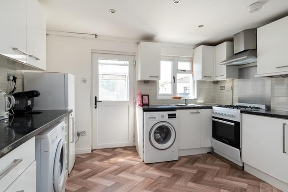 Kitchen or kitchenette, dishwasher, oven, stove, toaster, washing machine, dryer