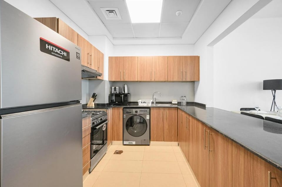 Kitchen or kitchenette, oven, stove, toaster, washing machine
