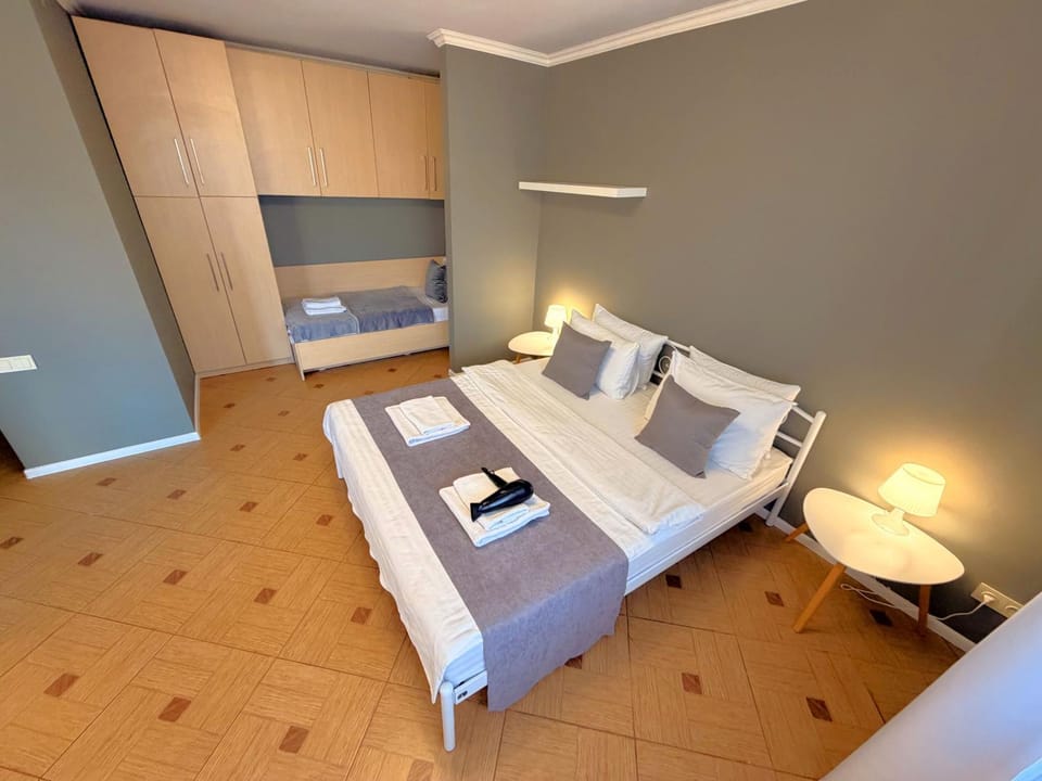 Bed, Living room, Photo of the whole room, Seating area, Bedroom, hair dryier, towels, wardrobe