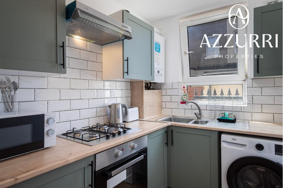 Kitchen or kitchenette, dishwasher, oven, stove, toaster, washing machine, dryer