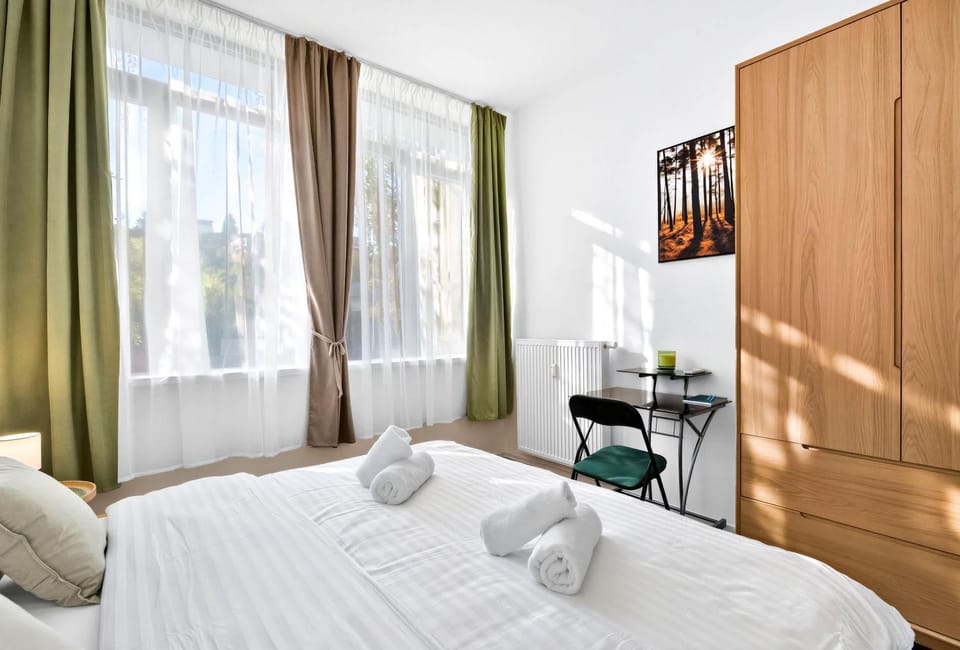 Bed, Seating area, Bedroom, towels, wardrobe