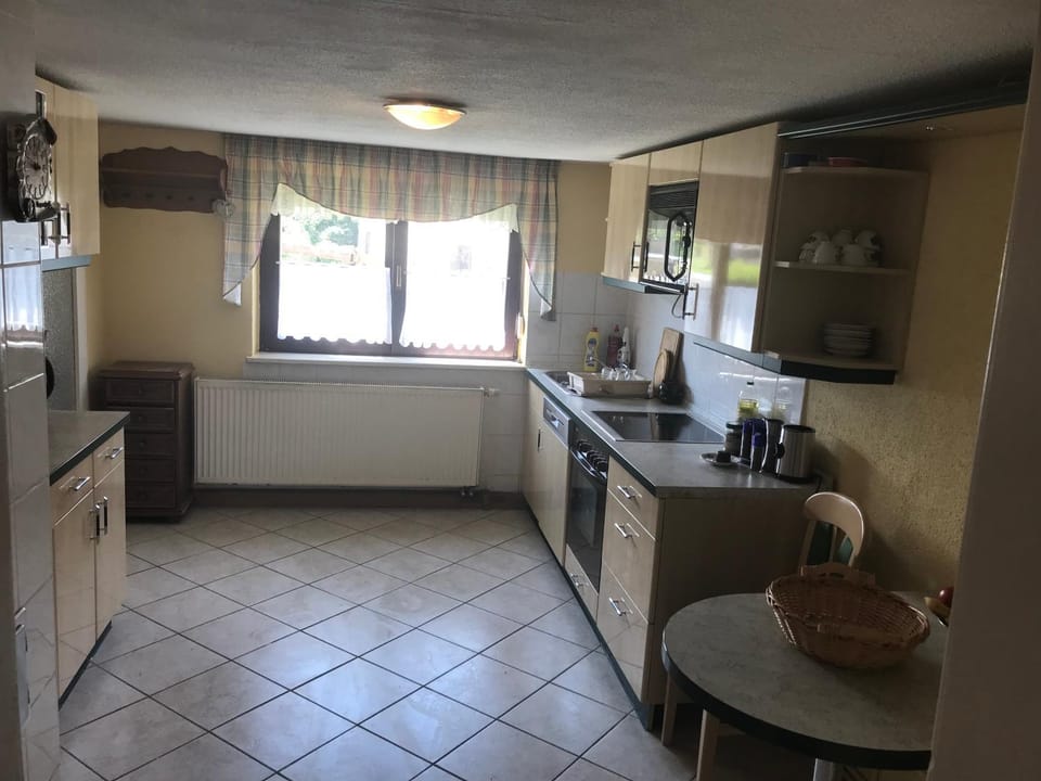Kitchen or kitchenette, dishwasher, oven, stove