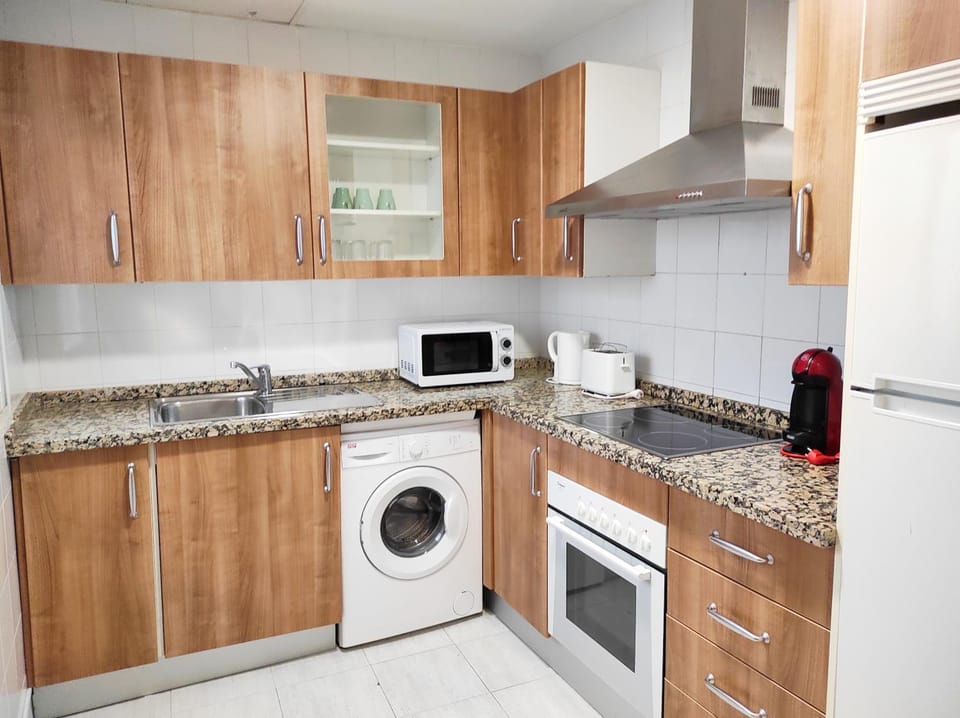 Kitchen or kitchenette, stove, toaster
