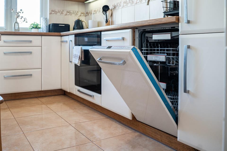 Kitchen or kitchenette, dishwasher, oven, stove, toaster