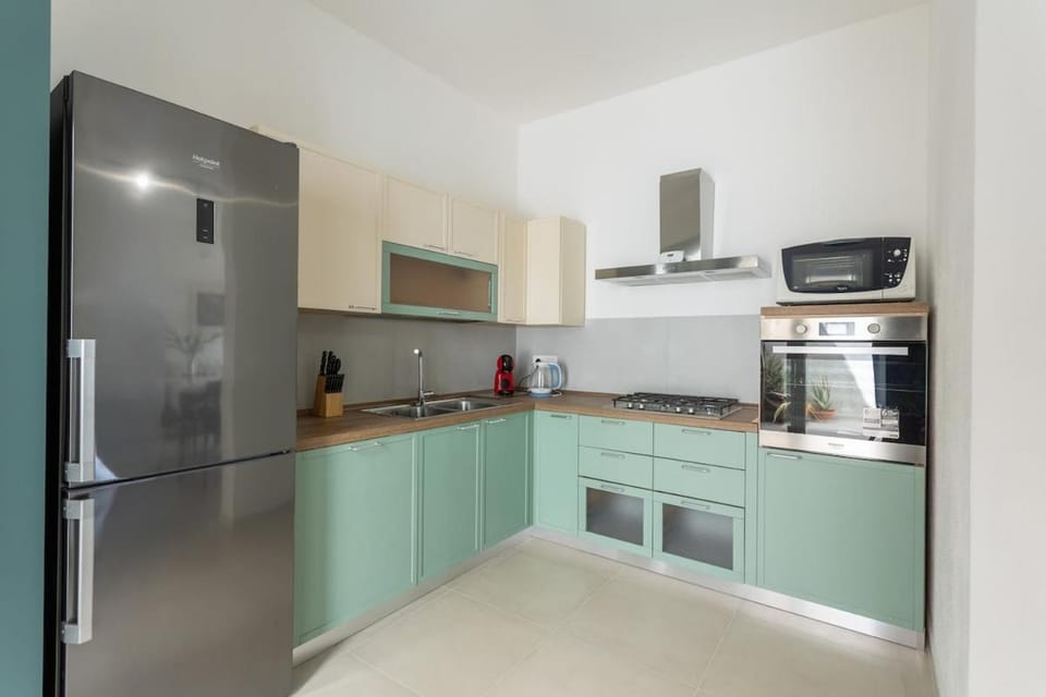Kitchen or kitchenette, dishwasher, oven, stove, toaster