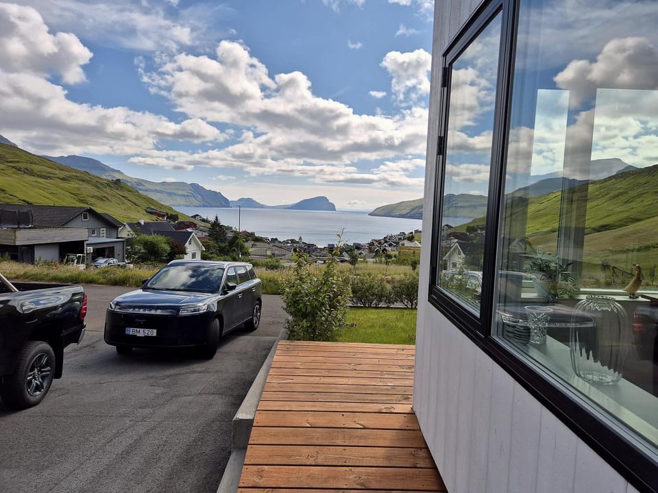 Panoramic Fjord Views in Modern Kvivik House House in Europe