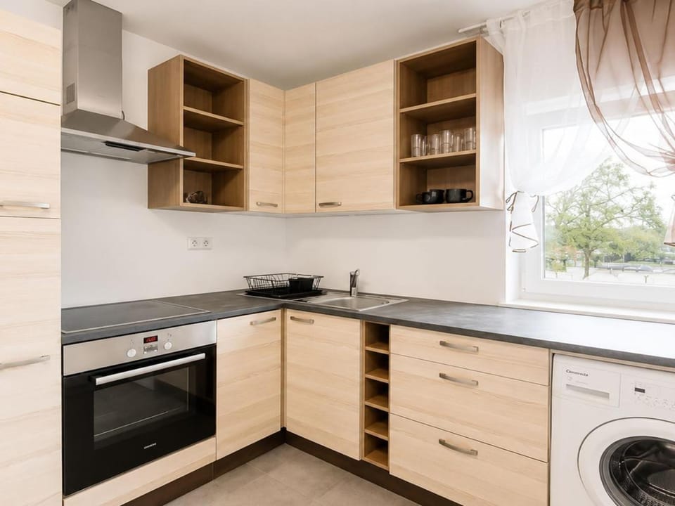 Kitchen or kitchenette, stove, washing machine
