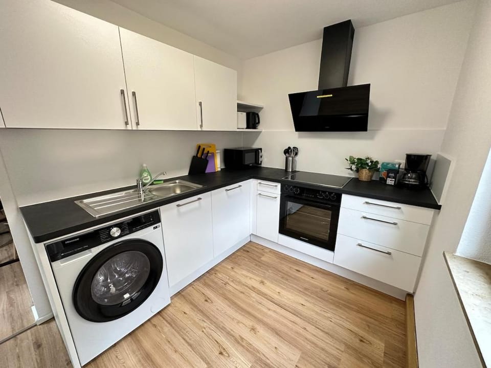 Kitchen or kitchenette, dishwasher, oven, stove, washing machine, dryer