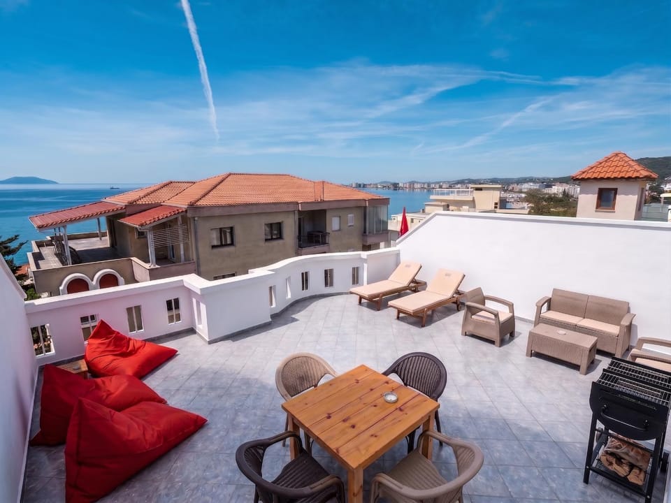 Property building, Patio, Communal lounge/ TV room, Day, Natural landscape, View (from property/room), Balcony/Terrace, Balcony/Terrace, Living room, Seating area, Beach, Evening entertainment, Sea view, sunbed