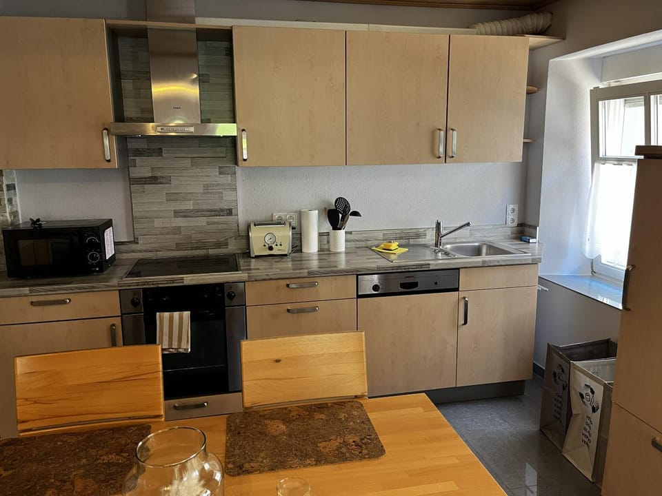 Kitchen or kitchenette, dishwasher, oven, stove, toaster