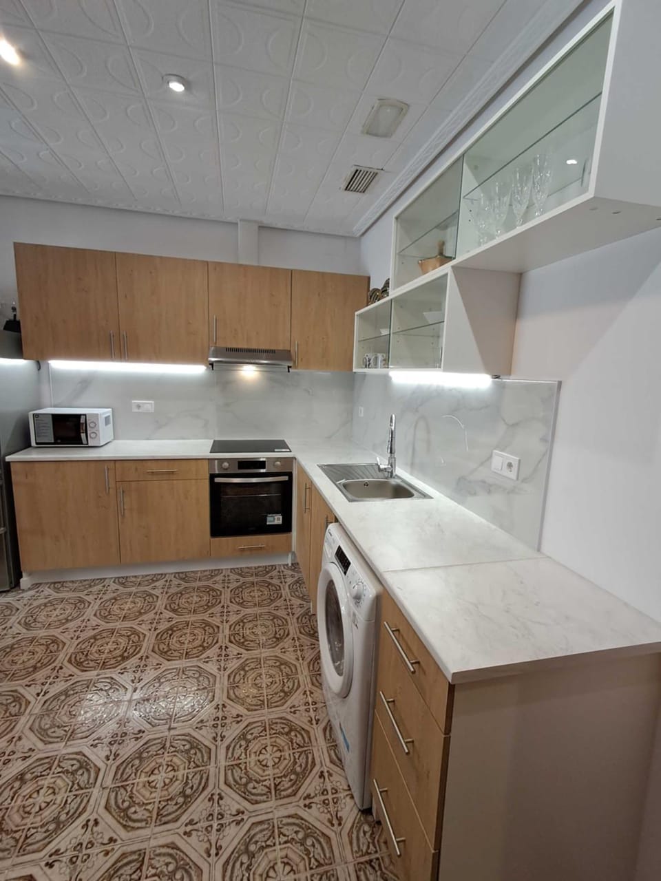 Kitchen or kitchenette, oven, stove, washing machine, dryer