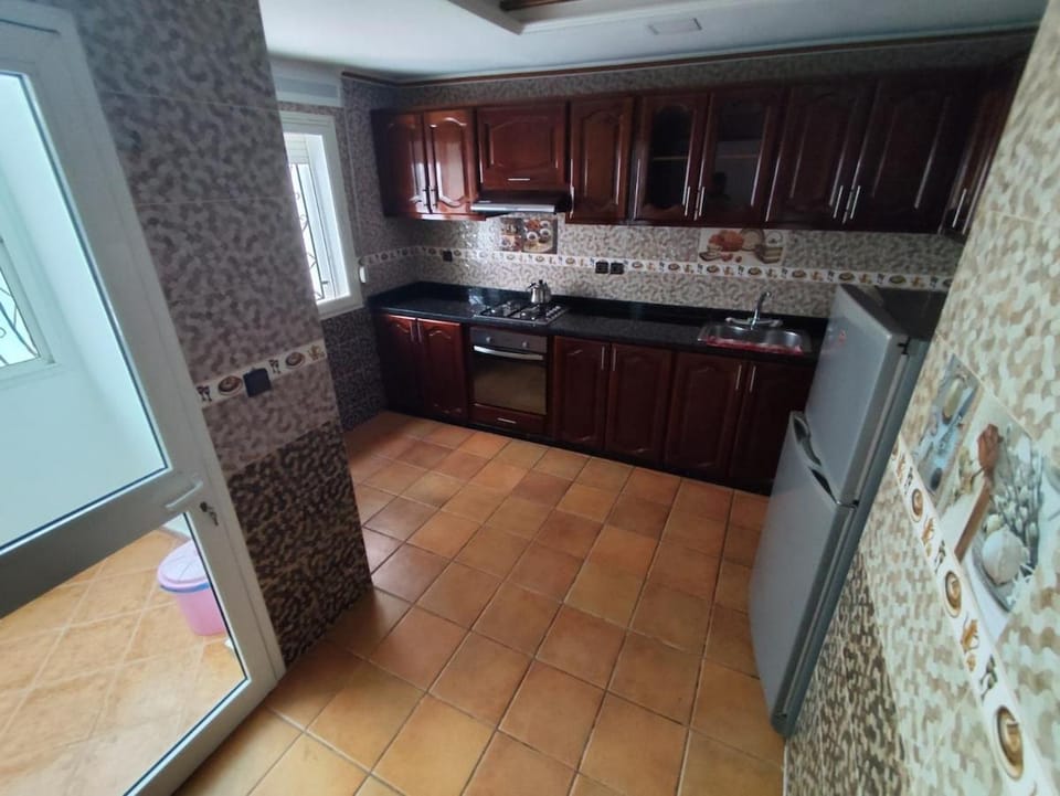 Kitchen or kitchenette, dishwasher, oven, stove