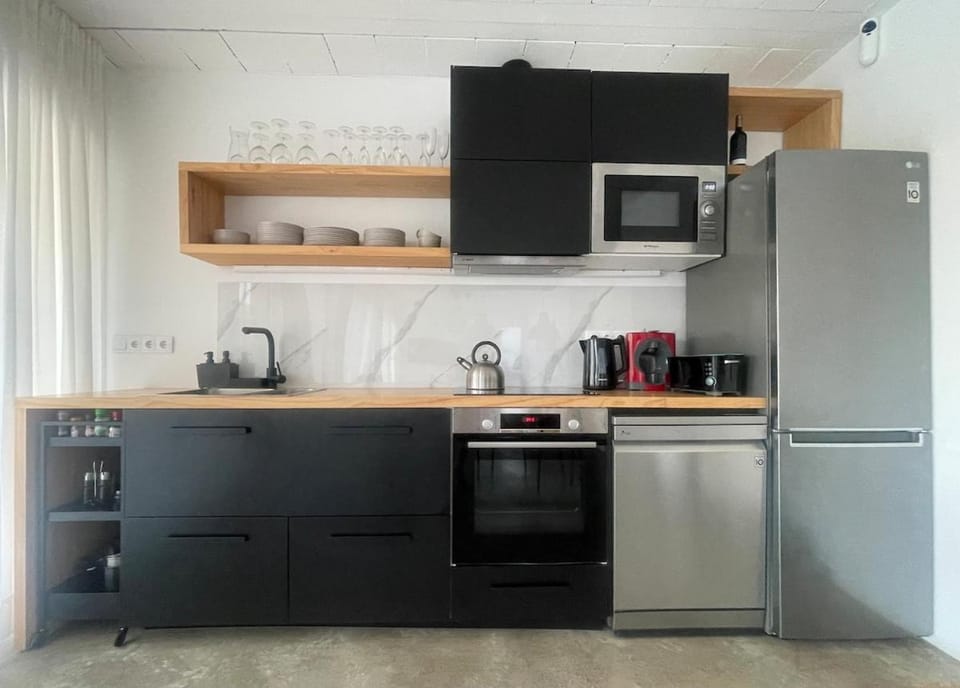 Kitchen or kitchenette, dishwasher, oven, stove, toaster