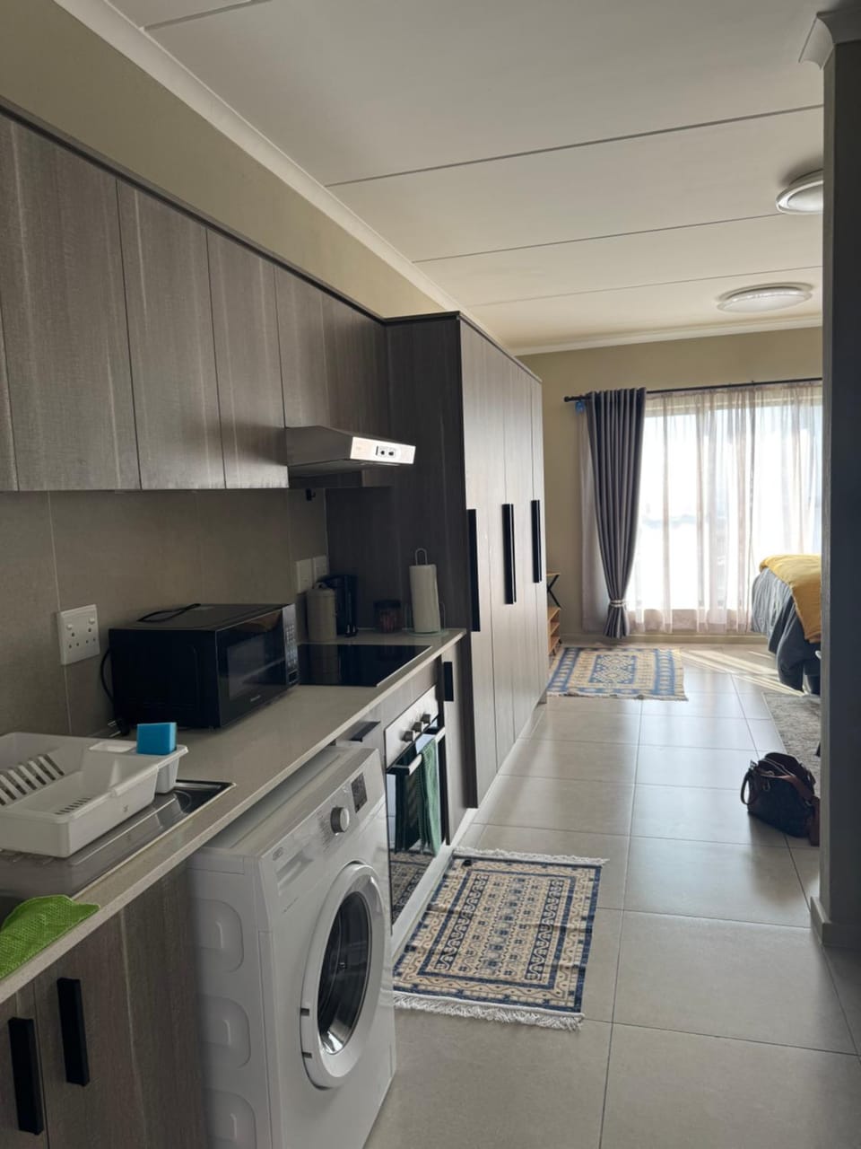 Kitchen or kitchenette, oven, stove, washing machine