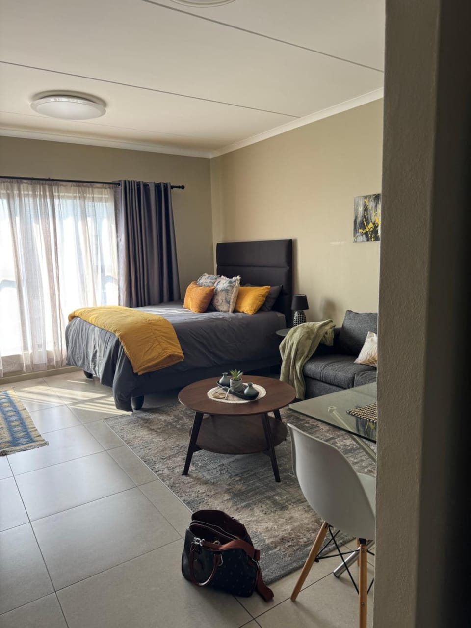 Bed, Living room, Seating area, Bedroom