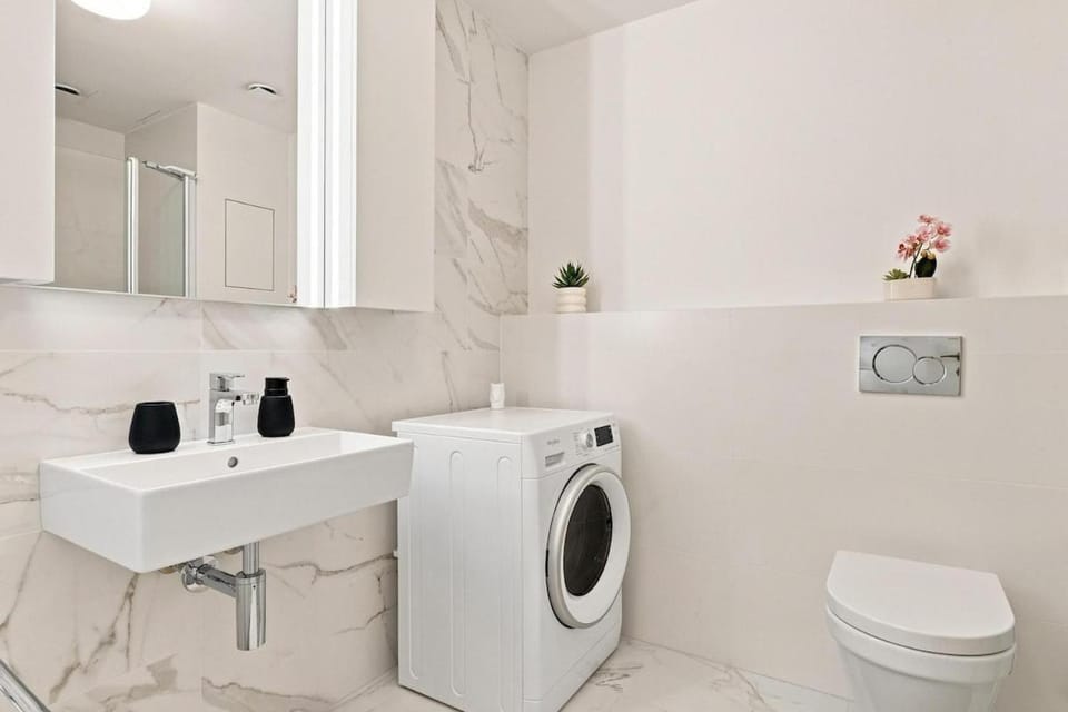 Toilet, Bathroom, towels, washing machine, dryer