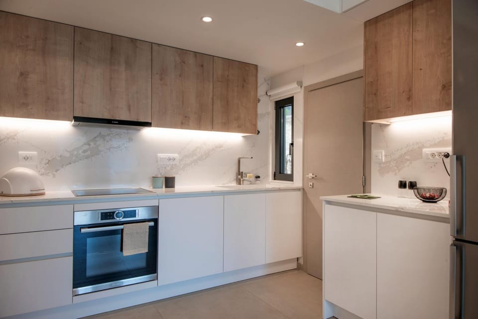 Kitchen or kitchenette, dishwasher, oven, stove