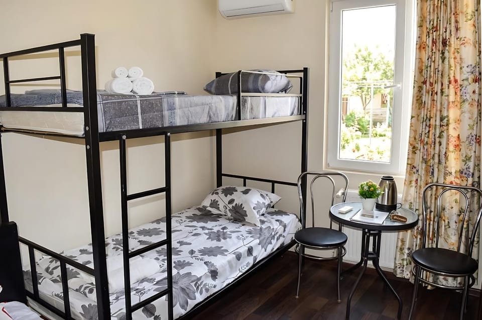 Bed, Photo of the whole room, Bedroom, bunk bed, towels, air conditioner