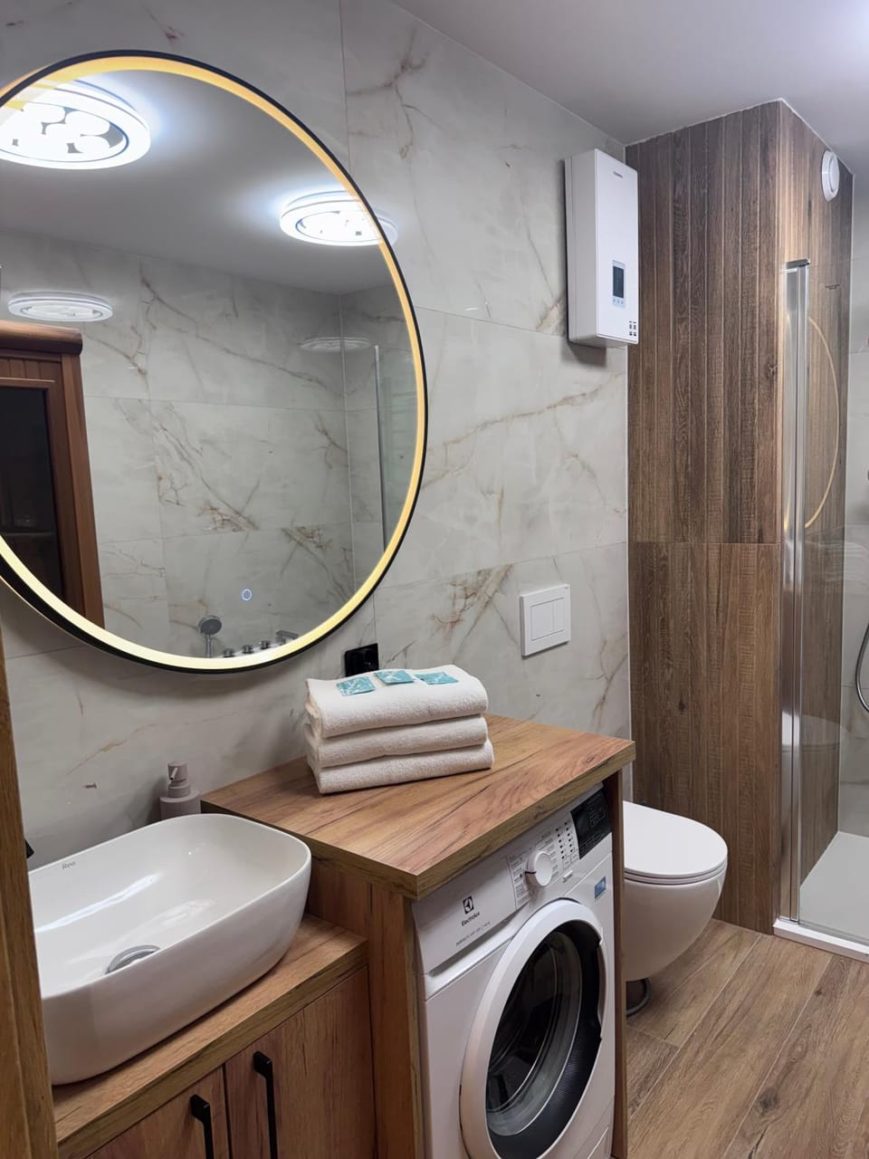 Shower, Toilet, Bathroom, towels, washing machine, dryer
