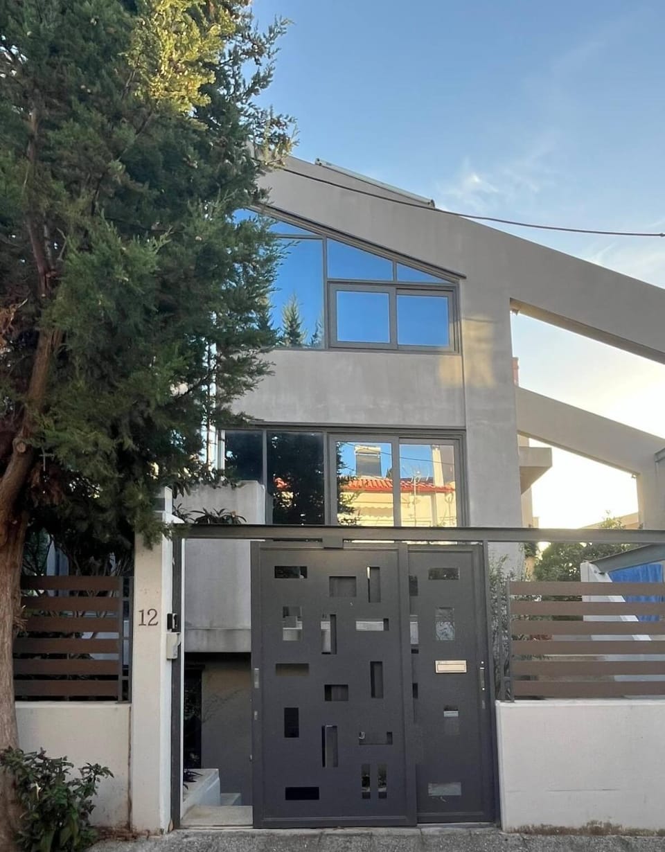 The HostMaster Glass House Apartment in Decentralized Administration of Attica