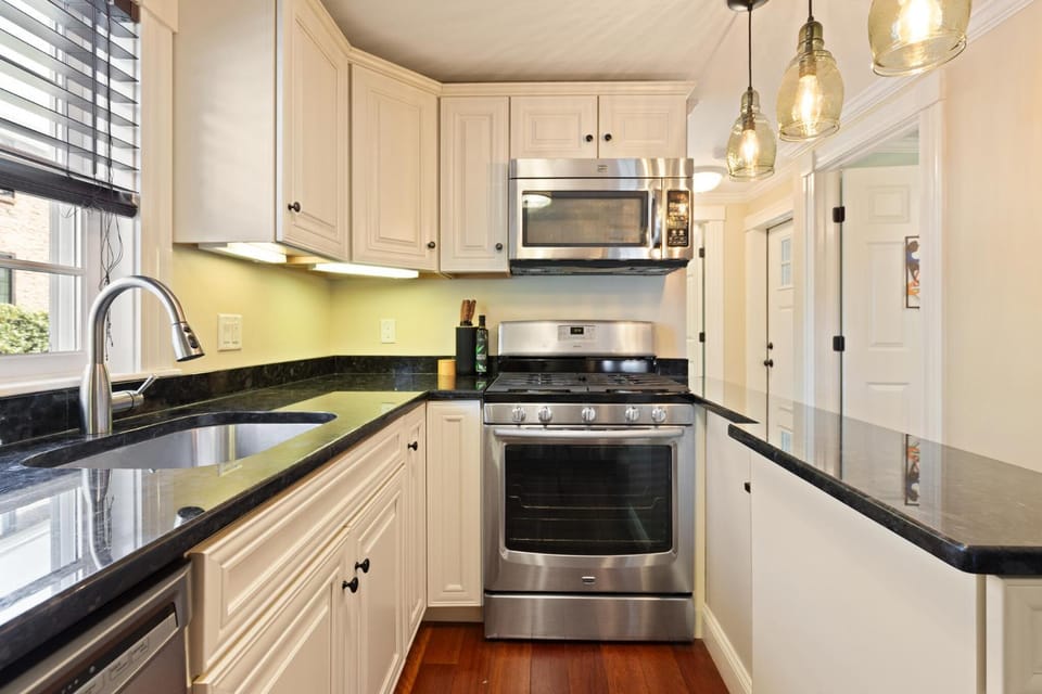 Kitchen or kitchenette, dishwasher, stove, toaster
