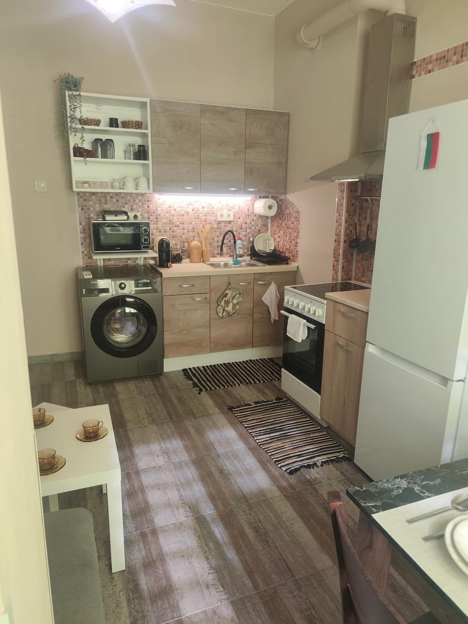 Kitchen or kitchenette, oven, stove, washing machine, dryer