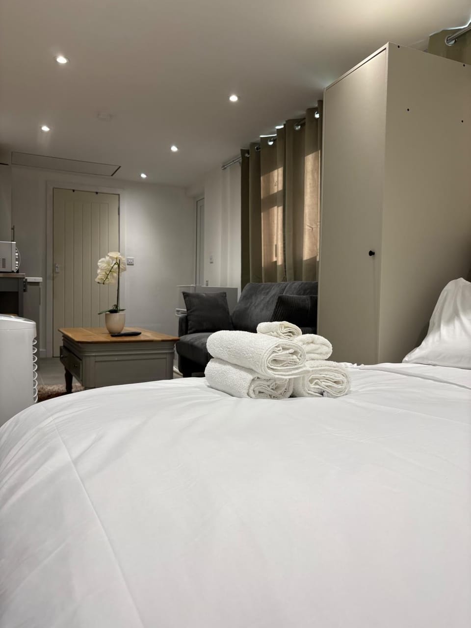 Bed, Living room, Seating area, towels, wardrobe