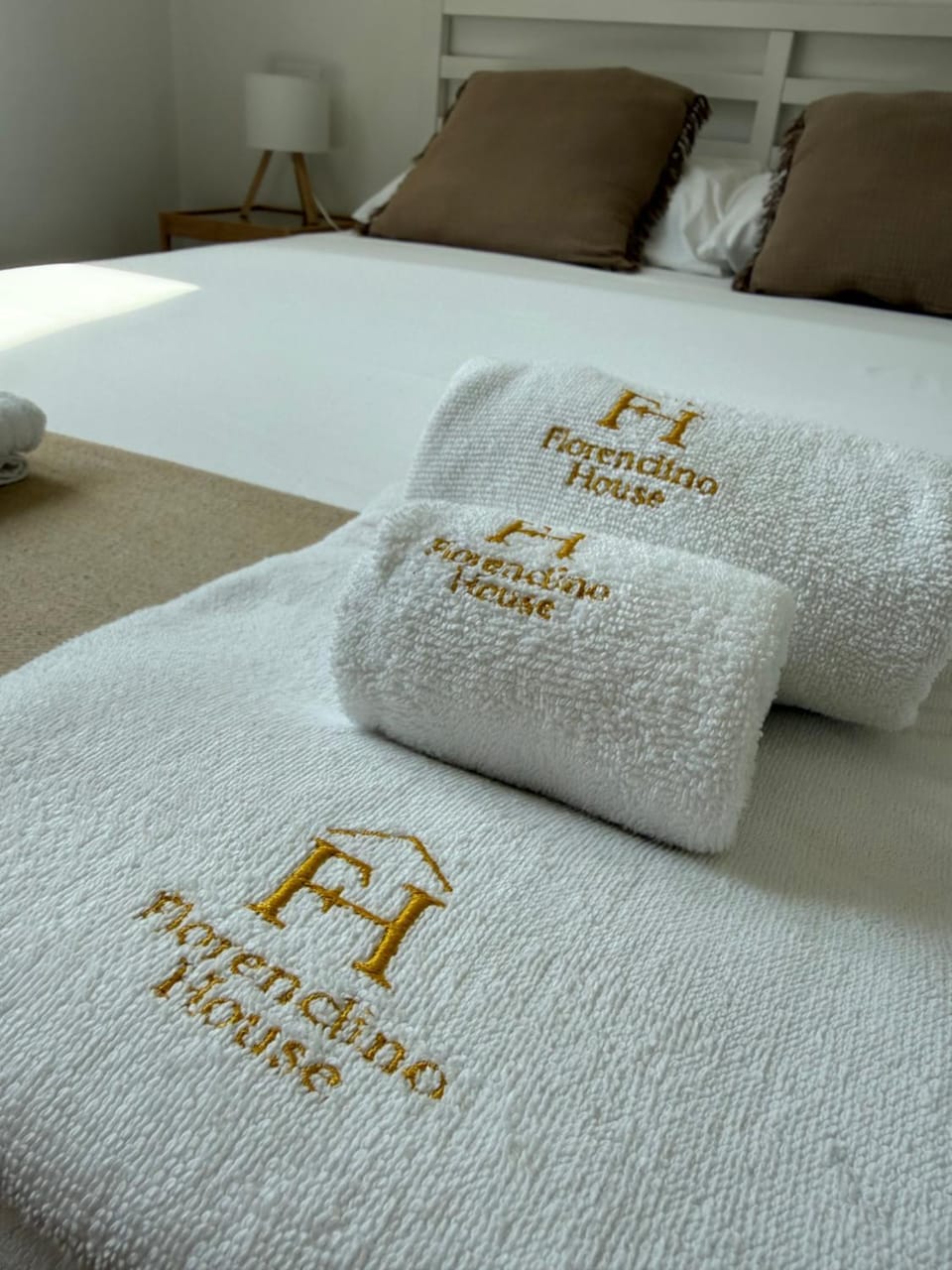 Bed, Property logo or sign, Bedroom, towels