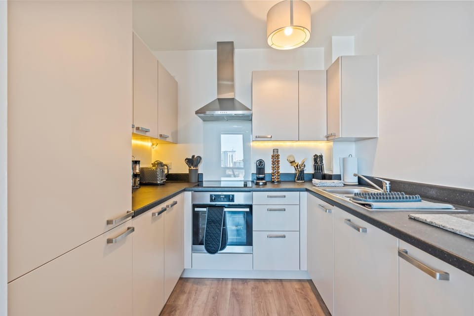 Kitchen or kitchenette, dishwasher, oven, stove, toaster