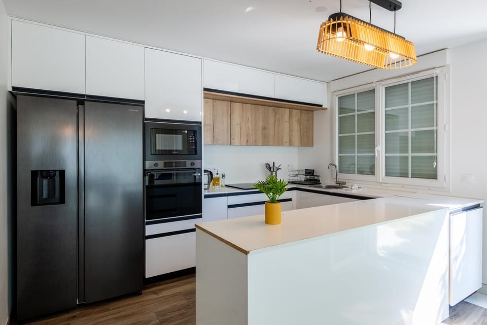 Kitchen or kitchenette, dishwasher, oven, stove