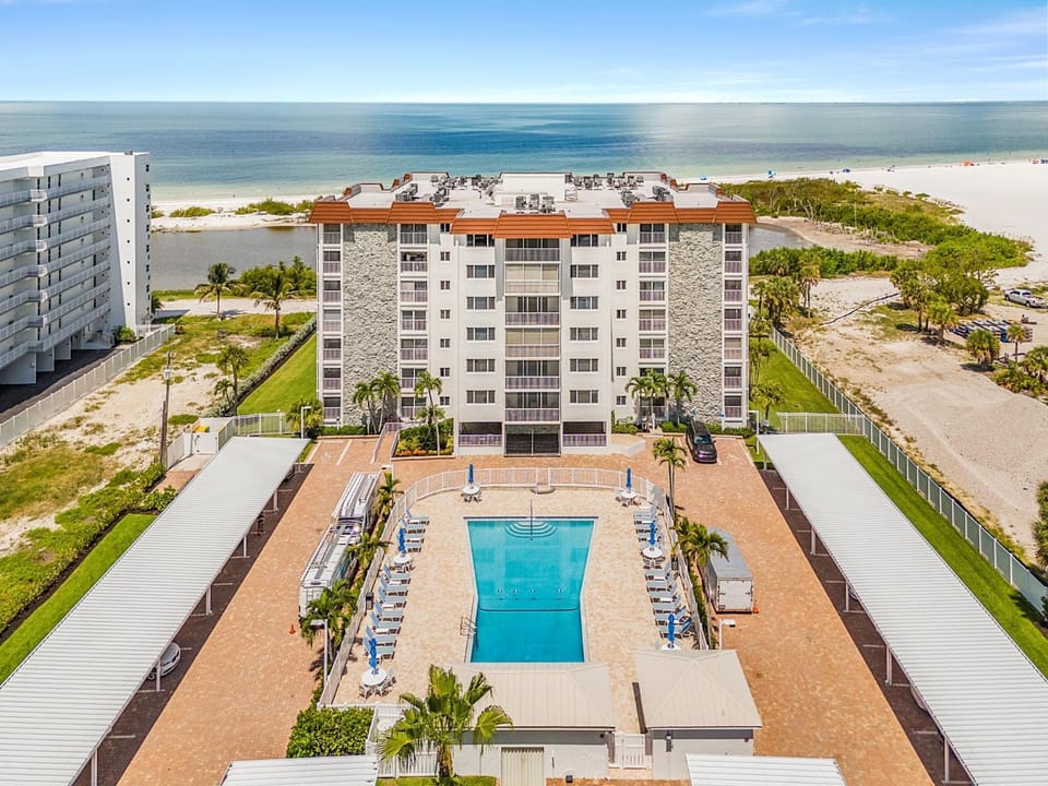 Beachfront Dual Condo Escape with Pool Gulf Views & Beach Access for Groups Sand Caper Roelens House in Estero Island