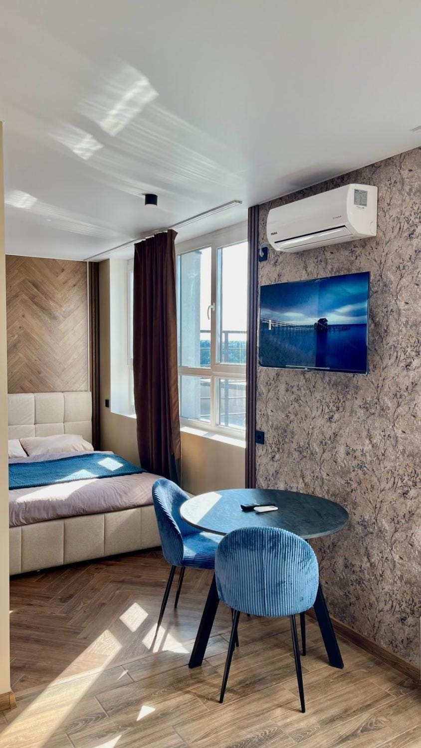 Bed, TV and multimedia, Seating area, Bedroom, air conditioner