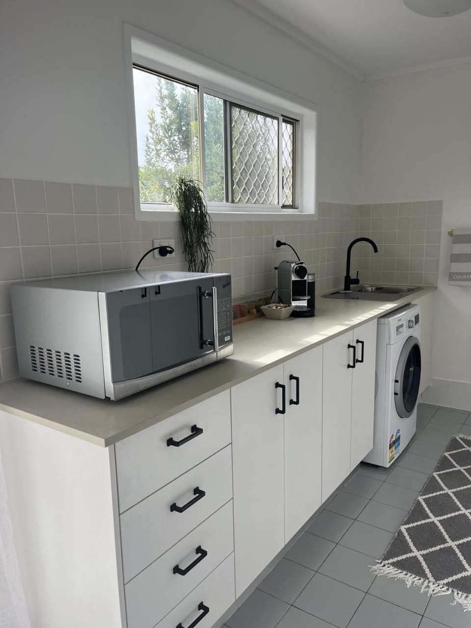 Kitchen or kitchenette, toaster, washing machine