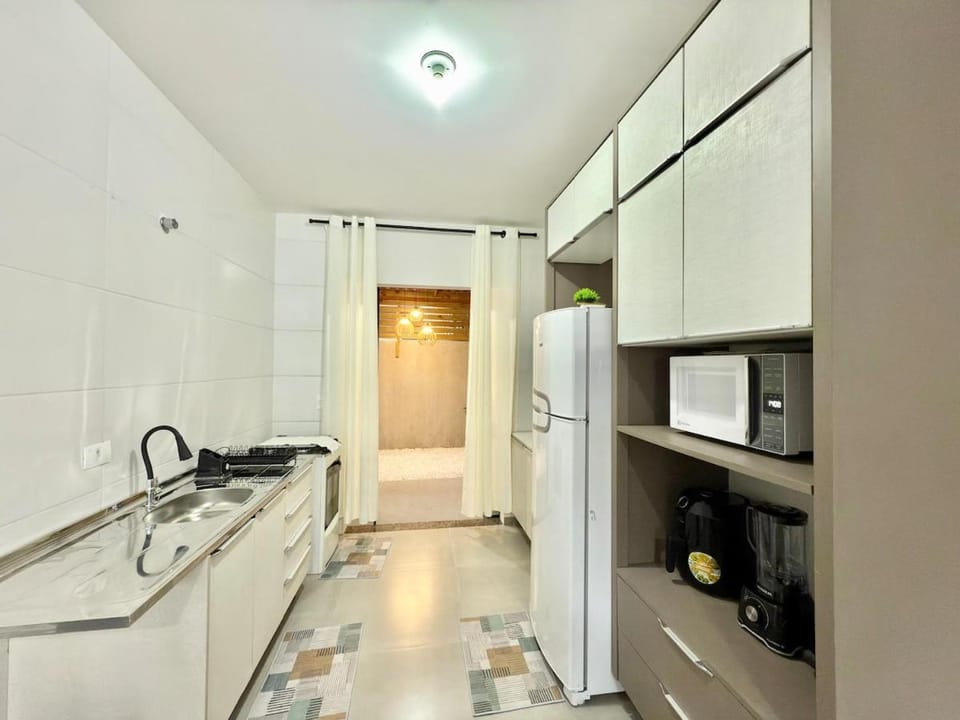 Casa com spa aquecido, suíte e garagem em Matinhos House in State of Paraná