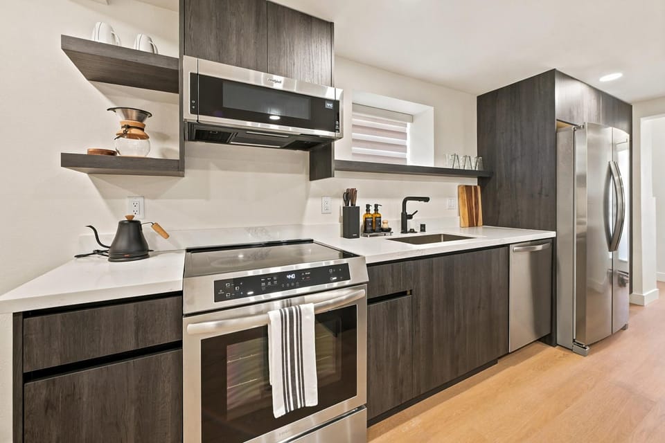 Kitchen or kitchenette, dishwasher, oven, stove
